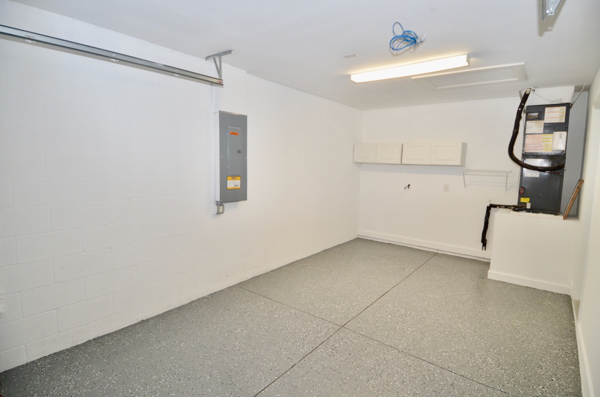 Attached garage with coated floor