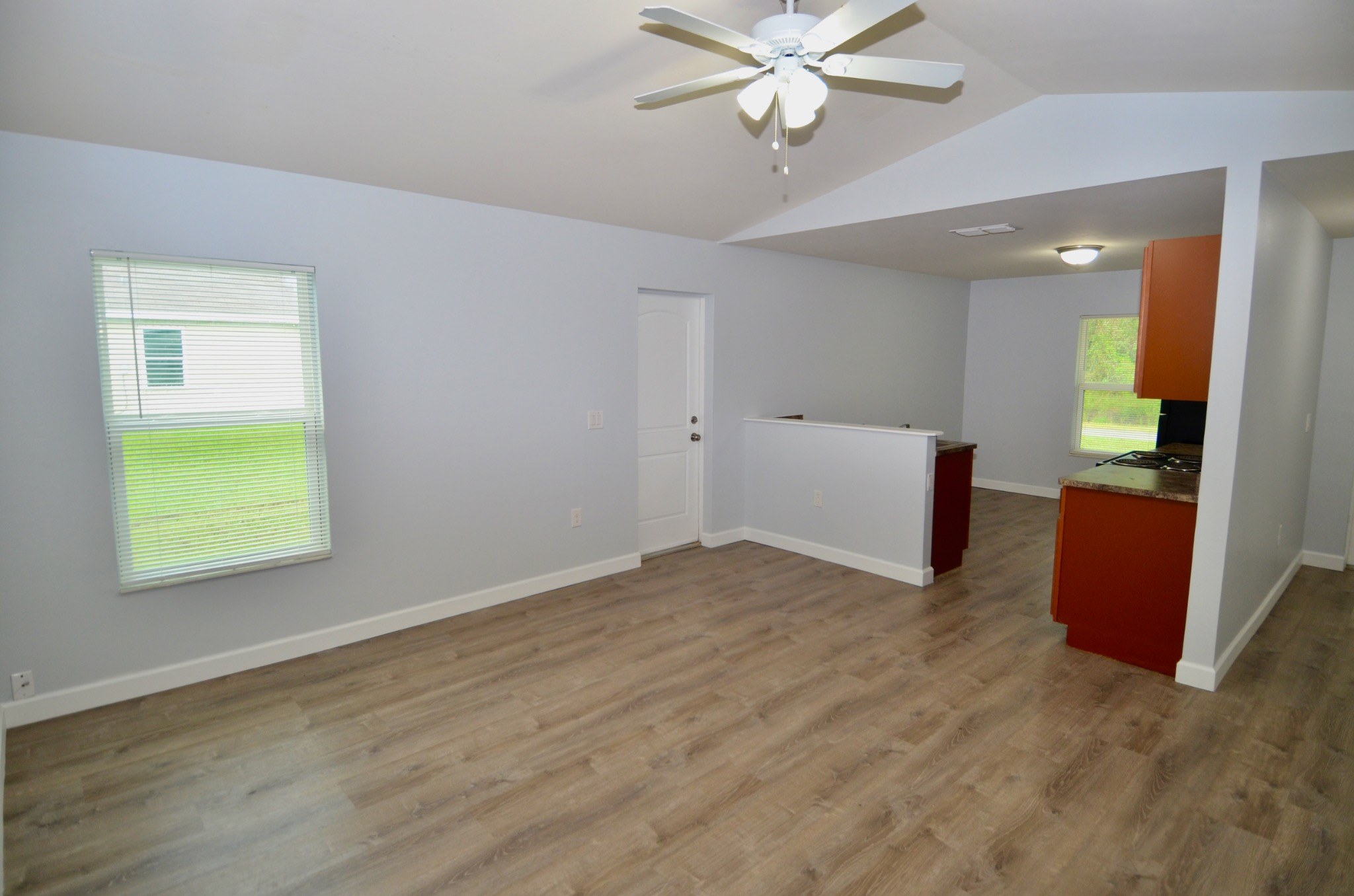 Open living area with cathedral ceiling